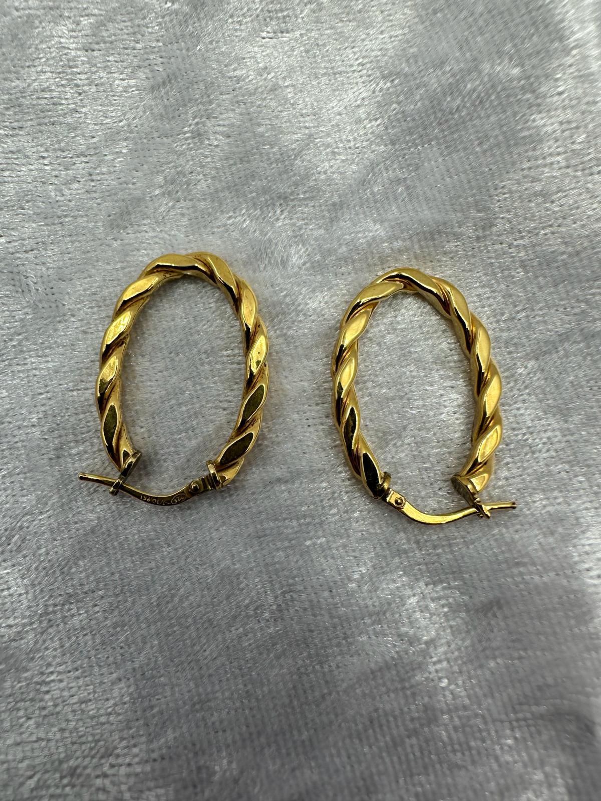 9K gold hoop earrings.