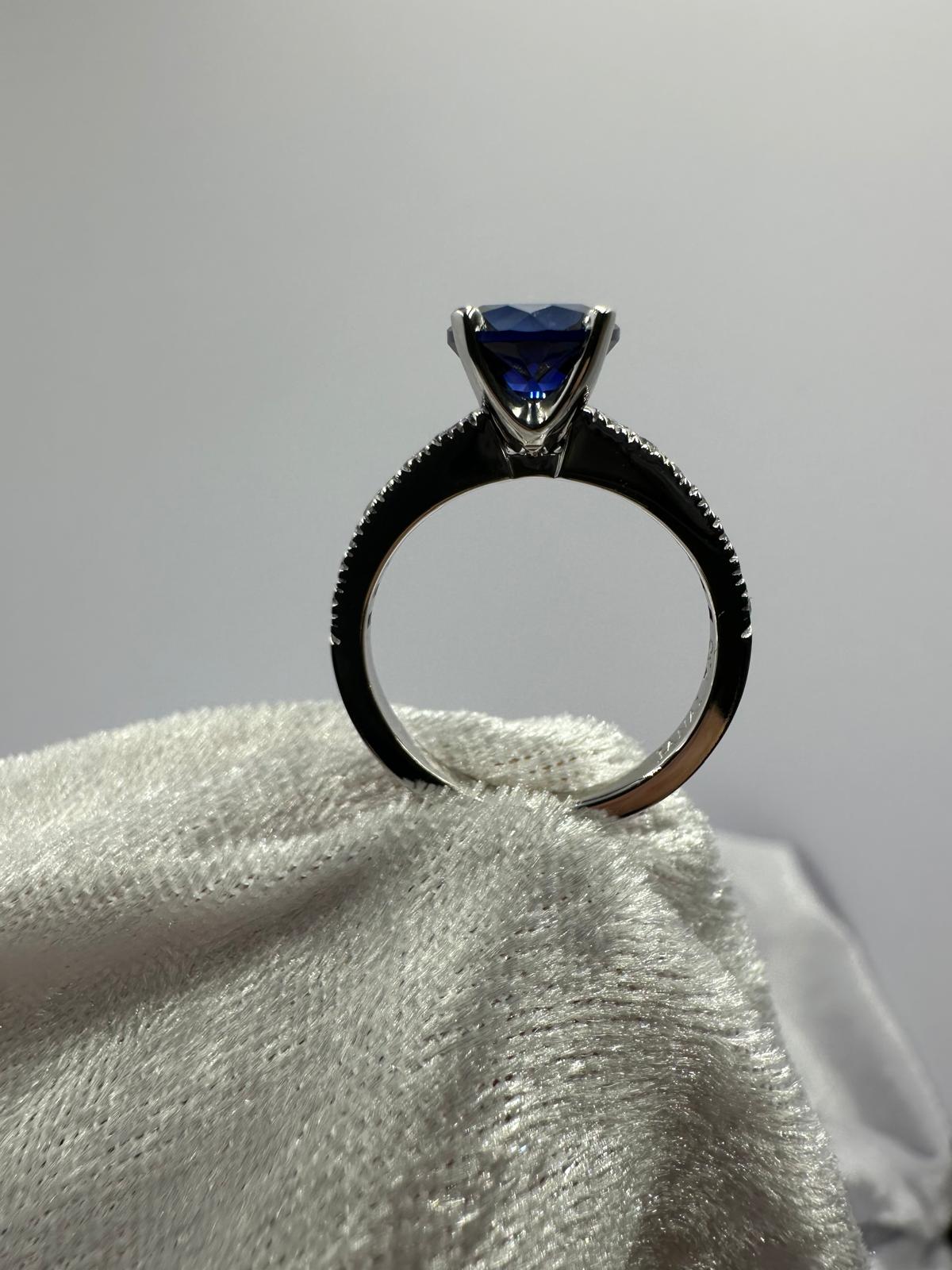 Deep blue round sapphire diamond ring