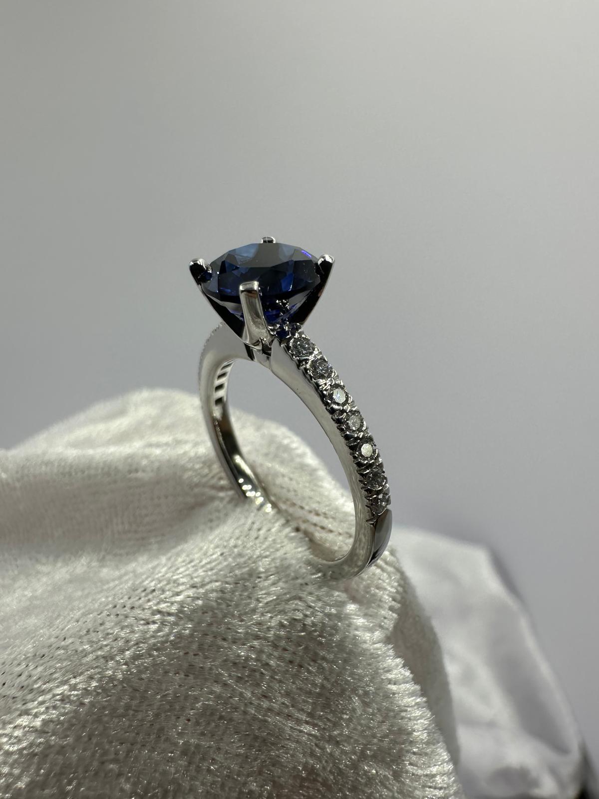 Deep blue round sapphire diamond ring